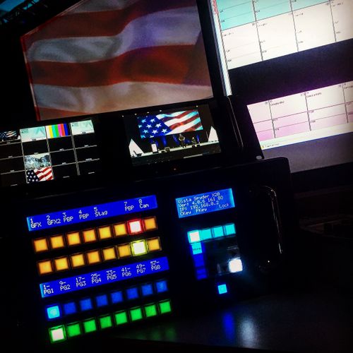 close up of a spyder x20 driving a playback of american flag videos